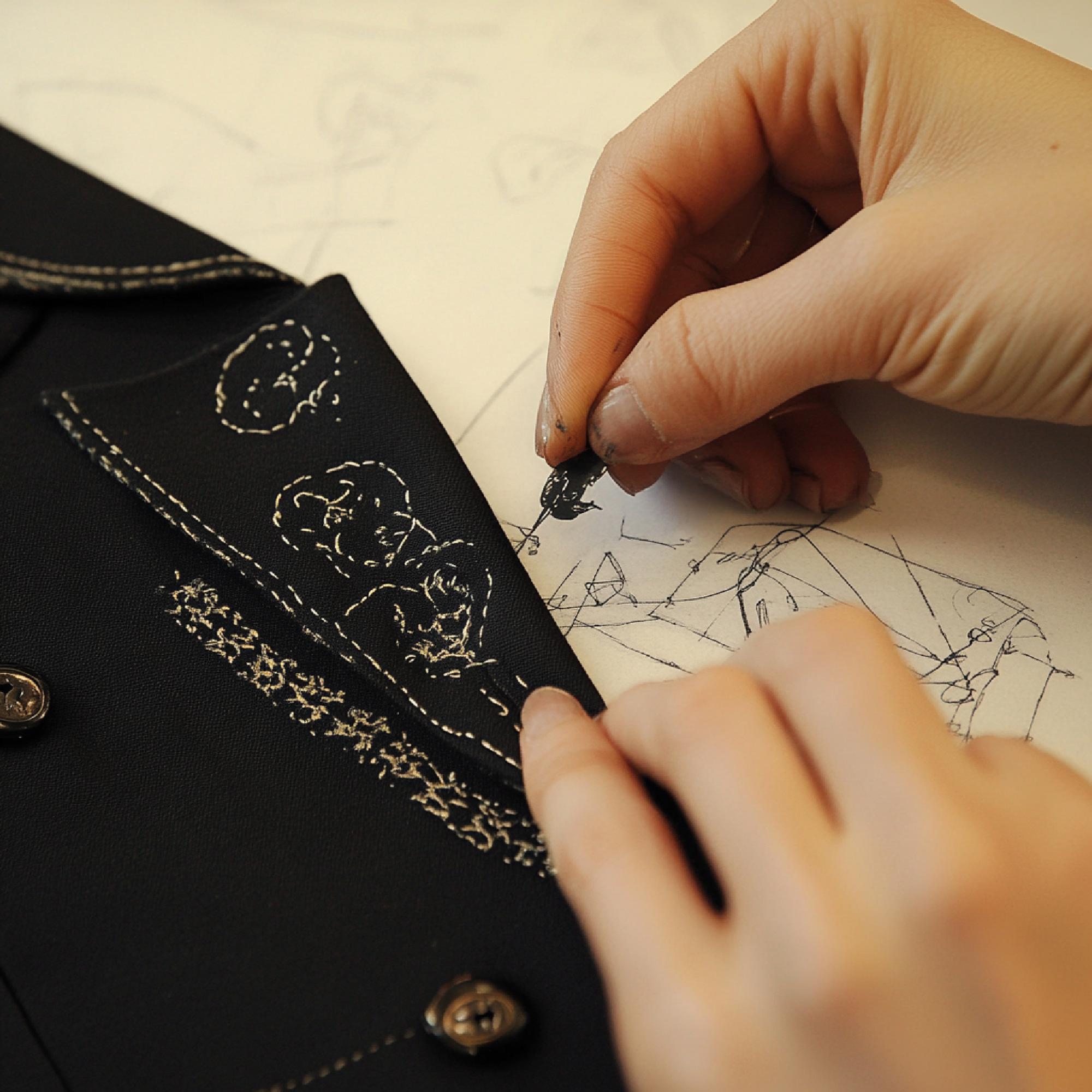 Design specialist sketching an embroidery motif